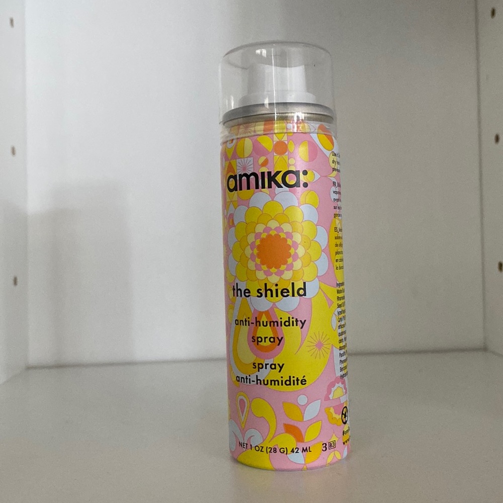 Amika the shield anti-humidity spray 1 oz in aerosol spray can.